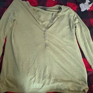 This is a medium green button up long sleeve.